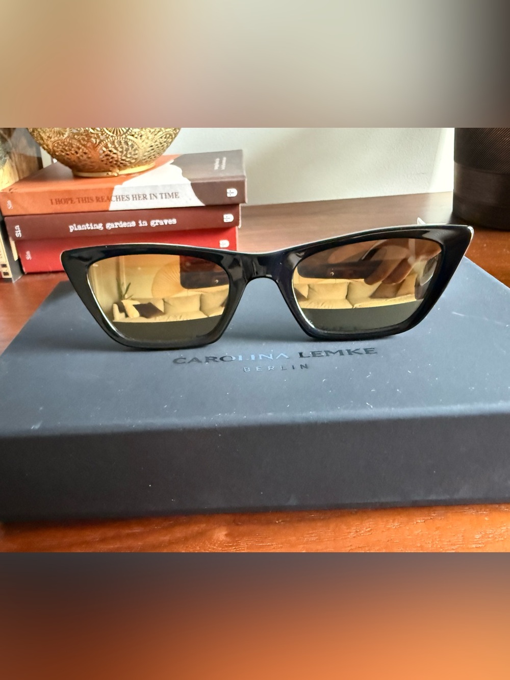 Carolina Lemke Black Cat-Eye Sunglasses with Amber Lenses